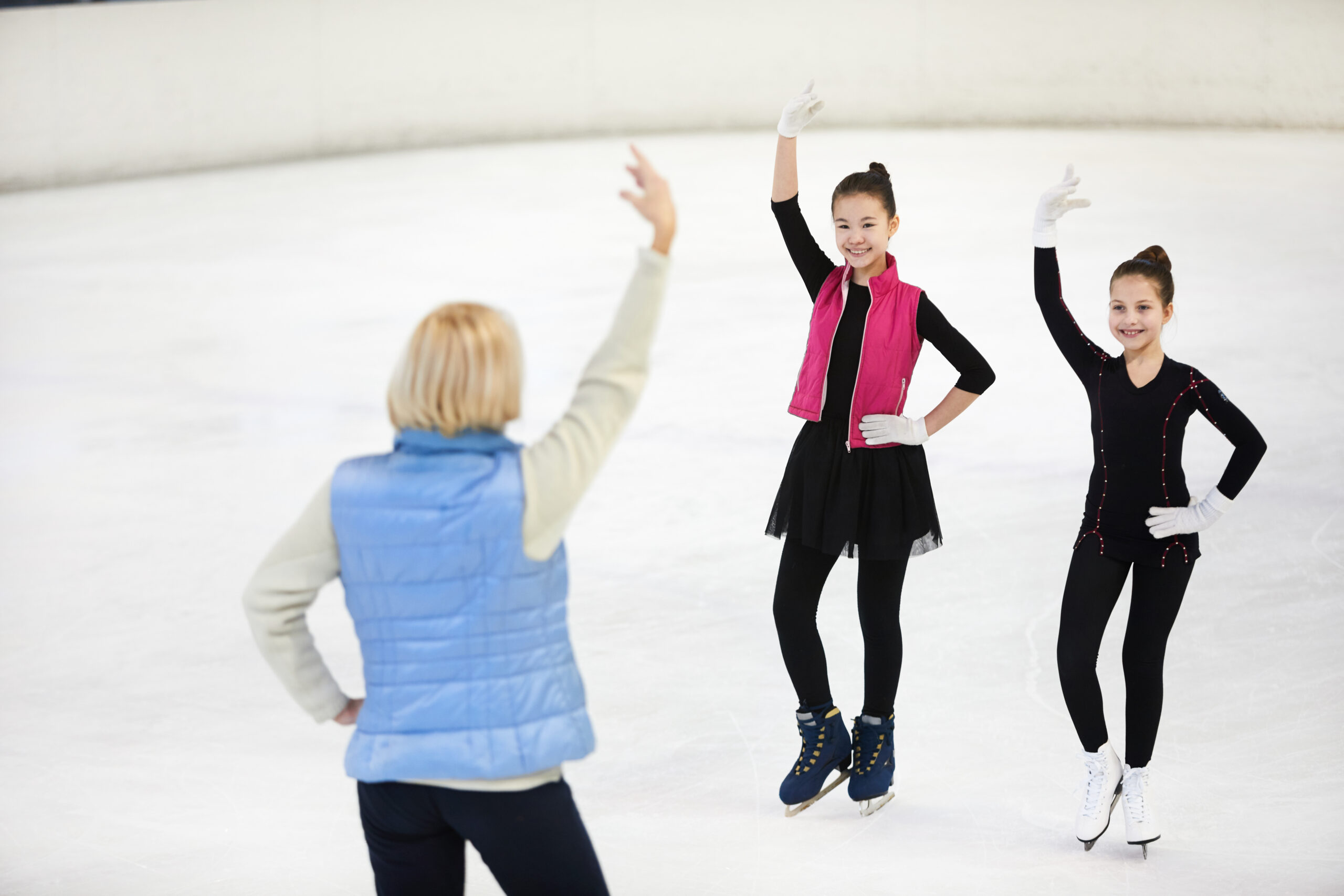 Female Coach Training Figure Skaters scaled